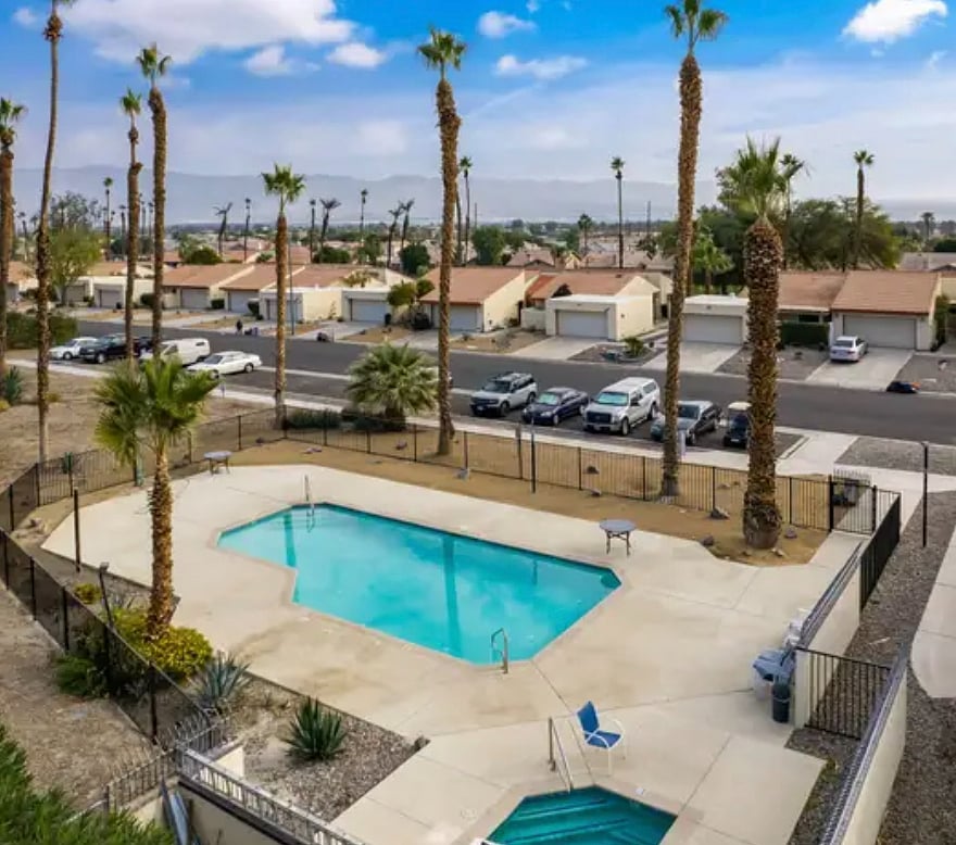 Community pool and spa/jacuzzi steps from the condo.