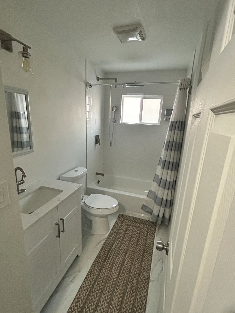 Full Bathroom with Tub, shower, and separate sprayer nozzle.