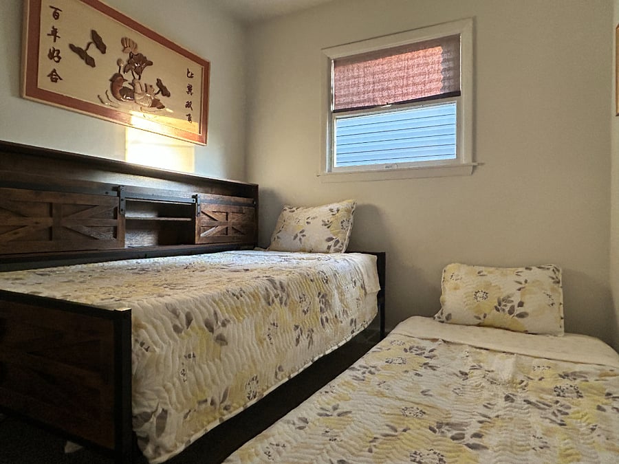 Bedframe has built-in storage, LED light strip, and a trundle bed that can be rolled away when not in use. 