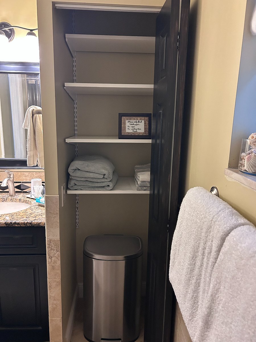 bathroom storage closet as well as under sink storage