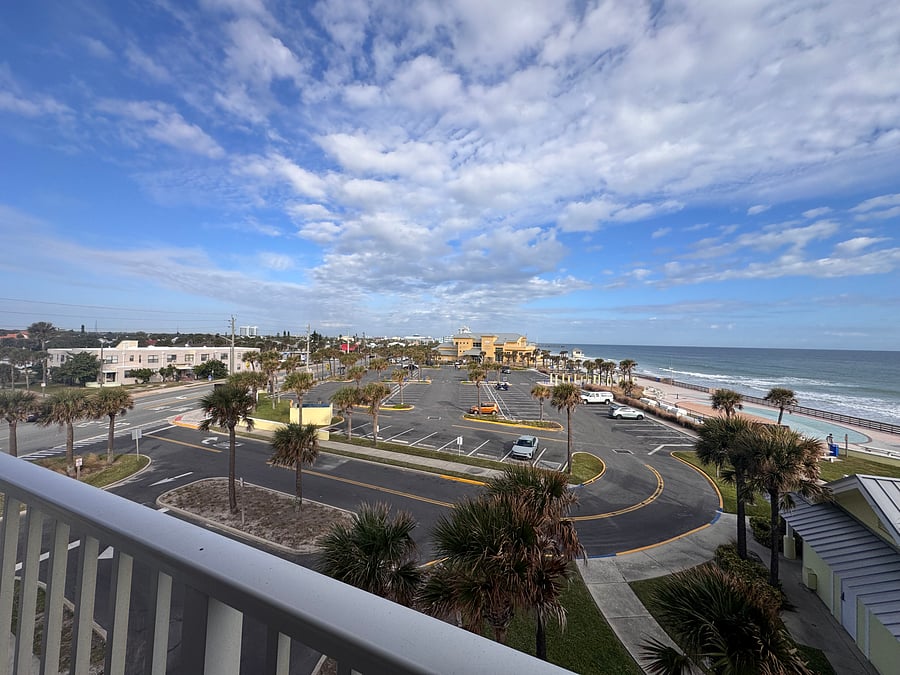 the yellow building is the LifeGuard Station. Swim with confidence being right next to the life guard