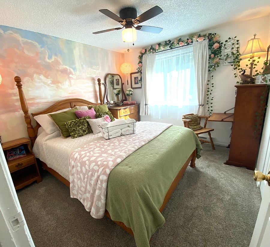 Enjoy the hand painted wall mural and relaxing feel of the Garden Room. Pull the black out curtains shut for a restful sleep.