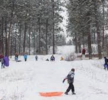 Underhill Park. Tennis courts, softball, woods trails and the best sledding around in winter. Just a few blocks away.
