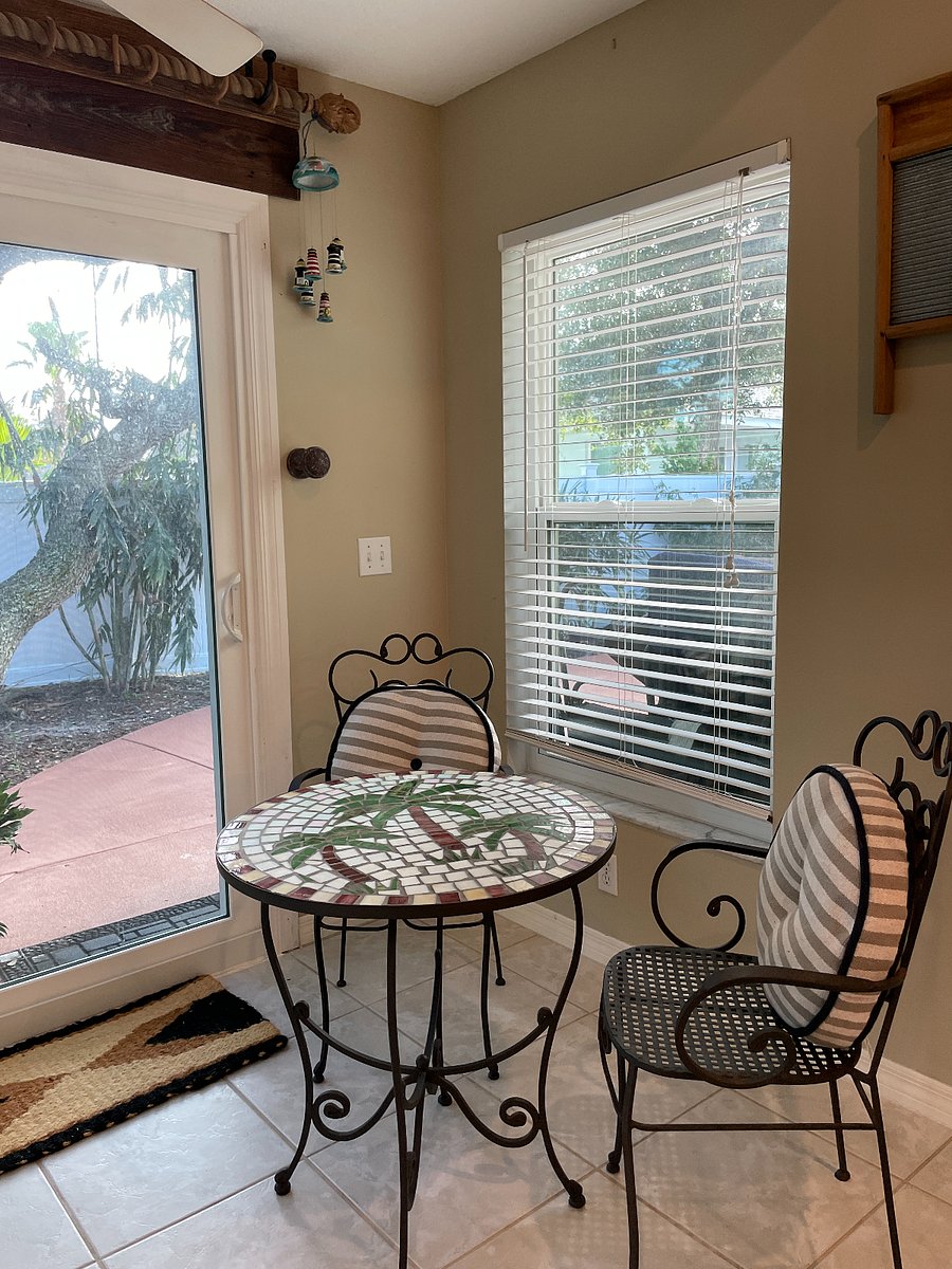 Bistro area in the kitchen has beautiful views of coastal oaks in  backyard.