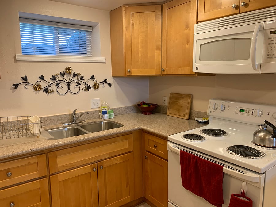 Full stove and oven for baking, microwave above