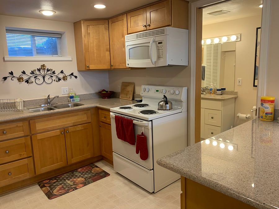 Full size kitchen, full bathroom behind pocket door