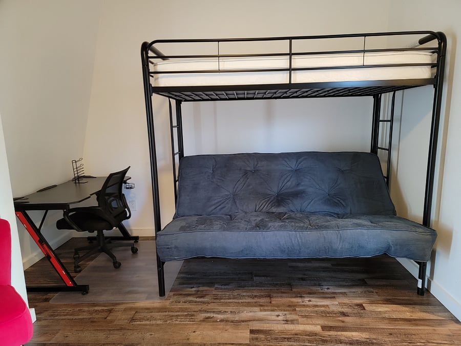 There is a sofa bed, full futon bed, and twin bed on top