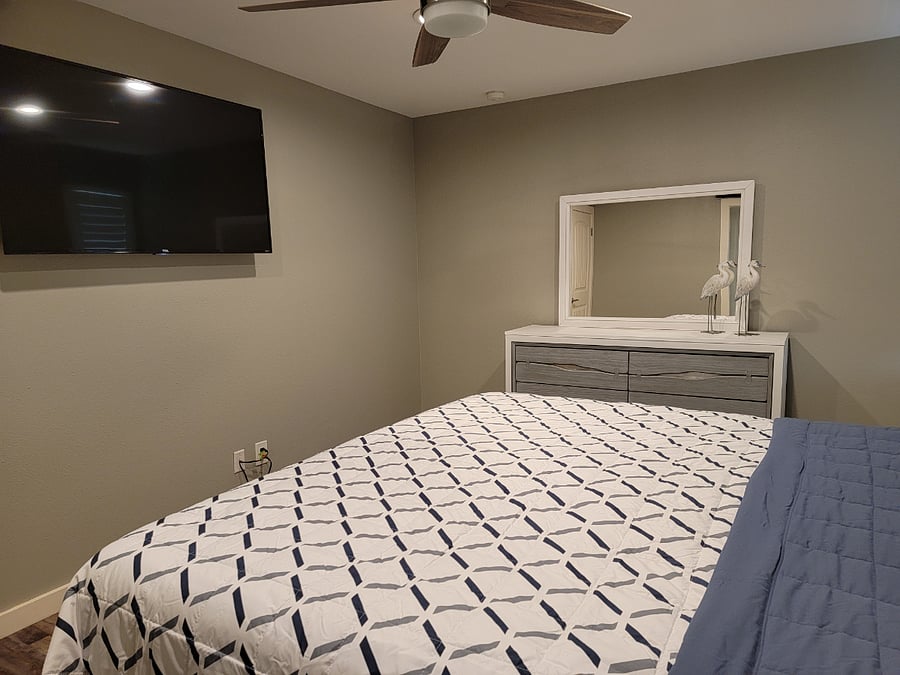 Second bedroom on lower level with queen bed