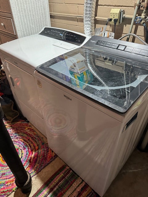Washer and dryer on site, located through the door from the bottom of the stairs.