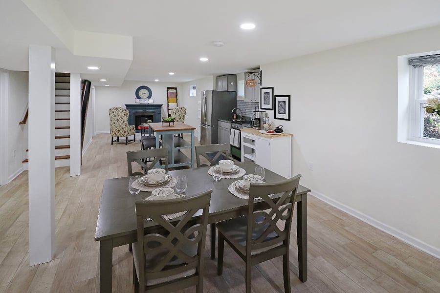 After the TV area comes the dining area, kitchen, and fireplace reading room!
