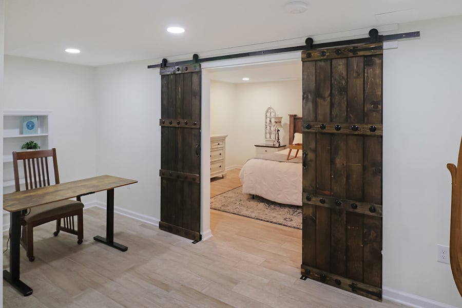 Office space with electric standing desk for the health of your body! 
Don't miss those drool worthy in-wall bookshelves!
Custom made castle barn doors welcome you to your inner sanctuary!