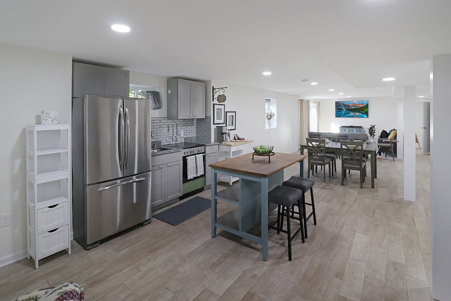 From kitchen to front of apartment view.
Includes kitchen, dining area, TV area. (Shows only half of the very large apartment)