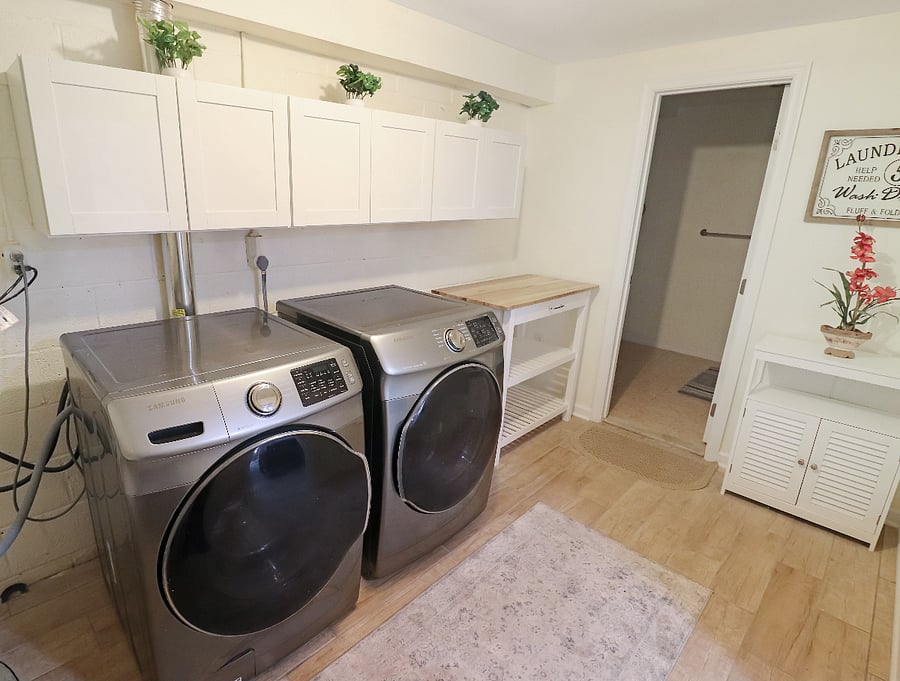 Full laundry facilities with lots of storage space.