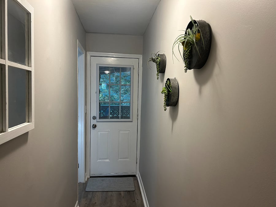 Hallway to back shade deck and to bathroom (on the left).V