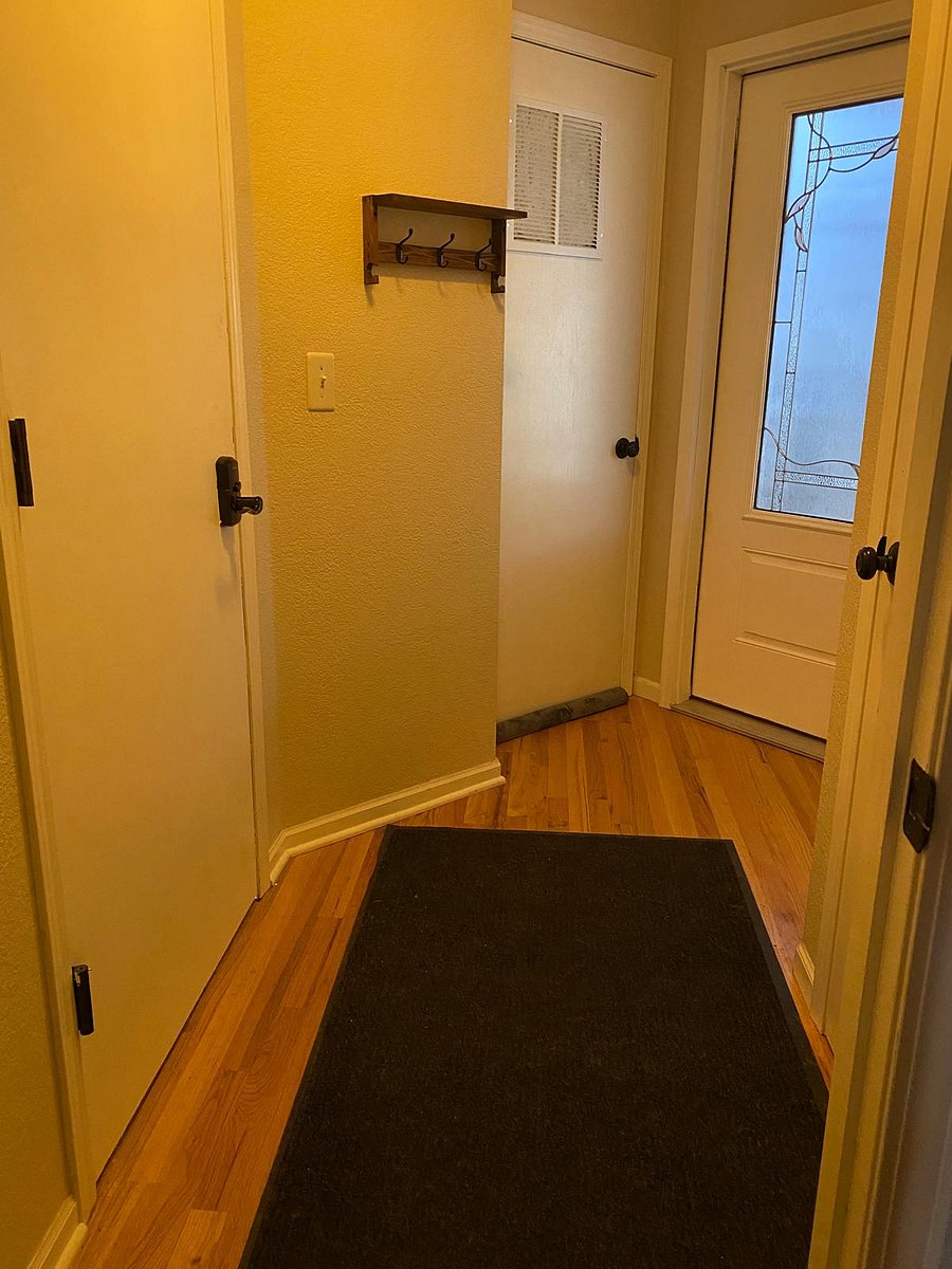 Entrance through garage door (left) and your door to the apartment (middle). The door far right is locked, separating my section of the home.