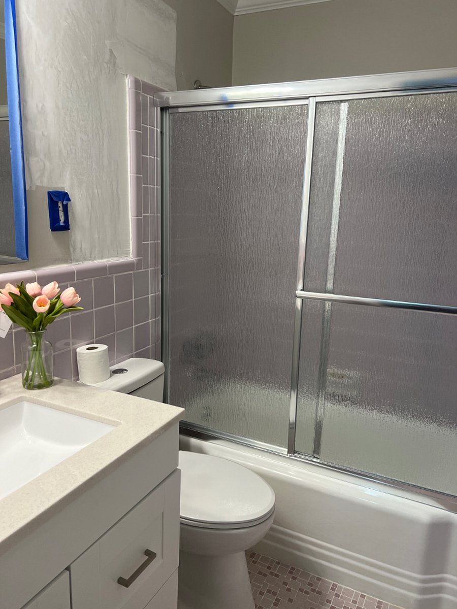 2nd bathroom, full tub with shower, shared between Bedroom 2 and Bedroom 3