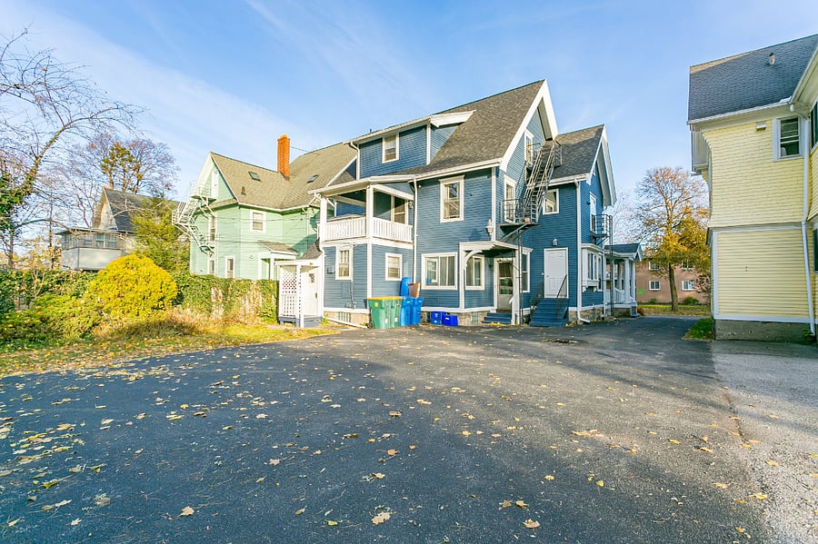 Covered private entrance on left of rear of house (leads to 3rd floor apartment)