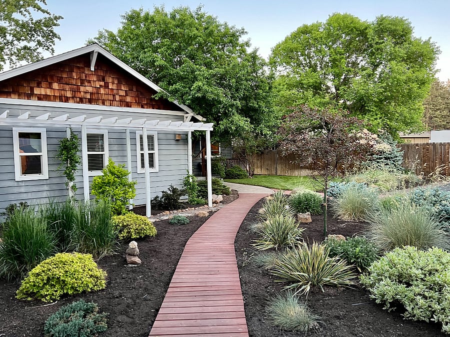 Landscaped yard with plenty of parking on the property.