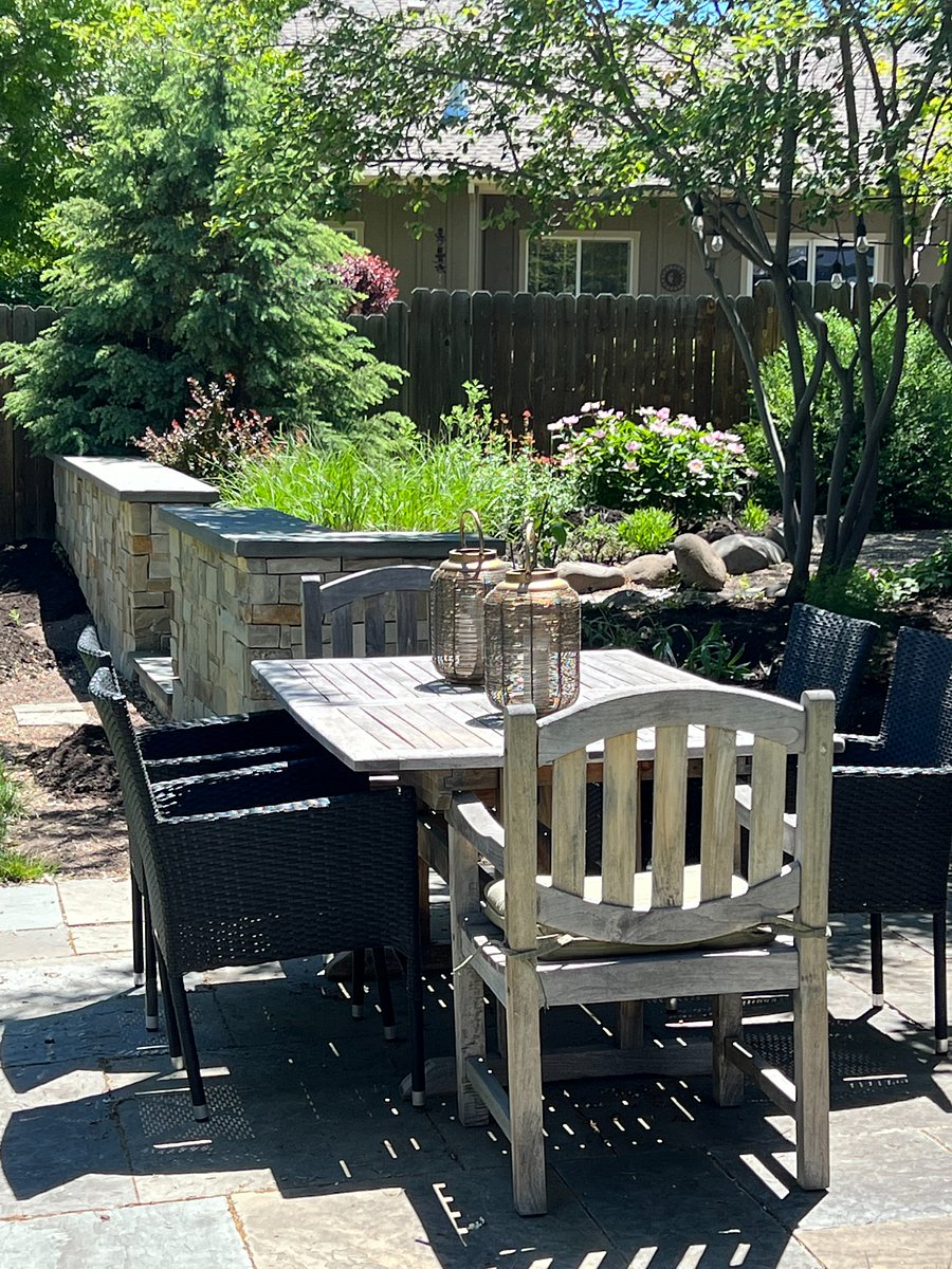 Gardens and yard surround you in this private outdoor space.