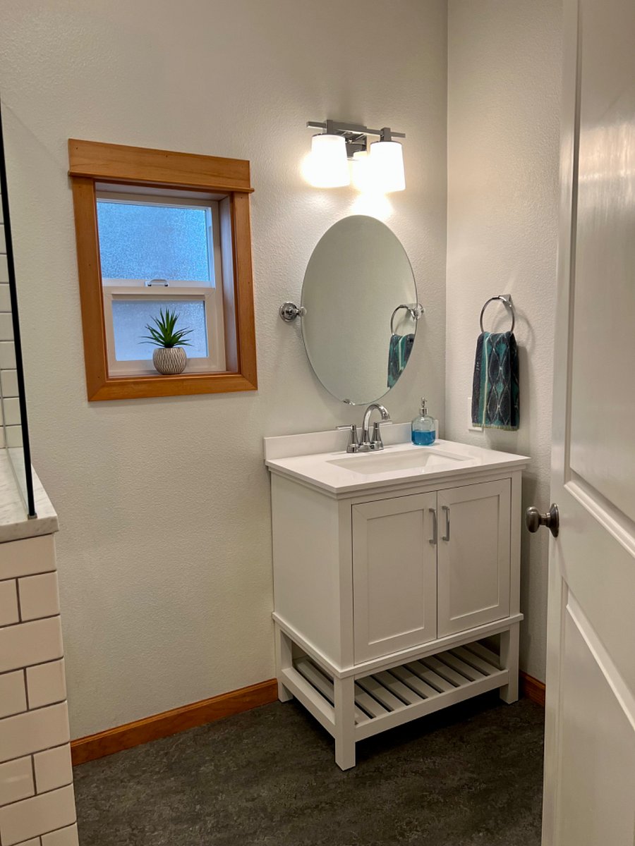 Private full bathroom with large vanity, plenty of counter space and storage underneath.