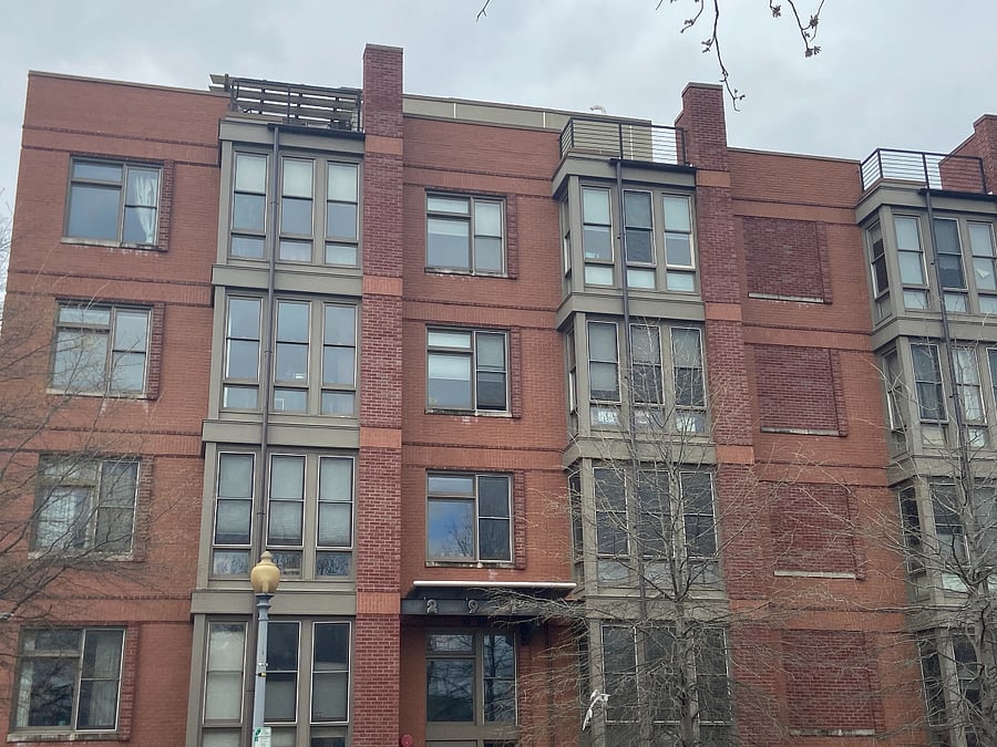 Front of building. Unit is top left