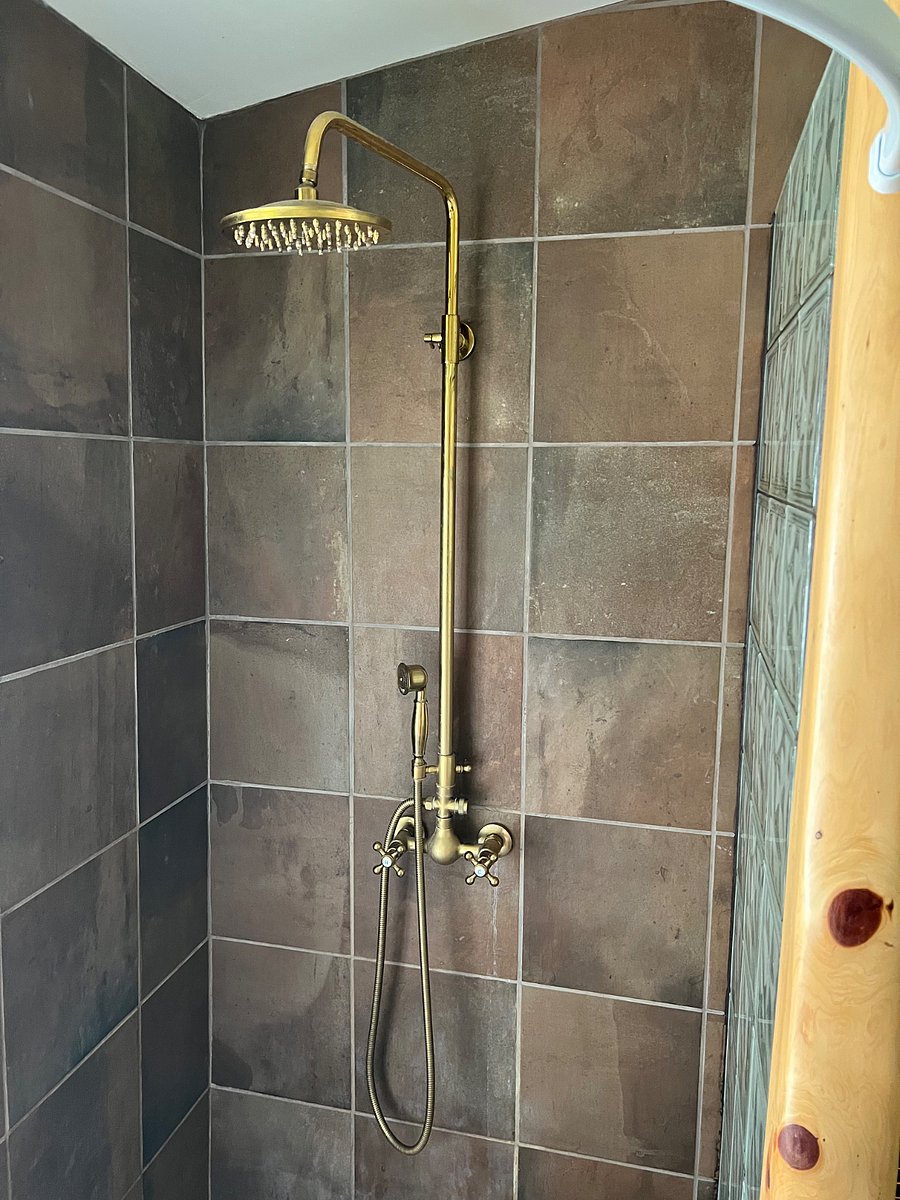 Your luxurious shower! It has a rain head and a handheld option.