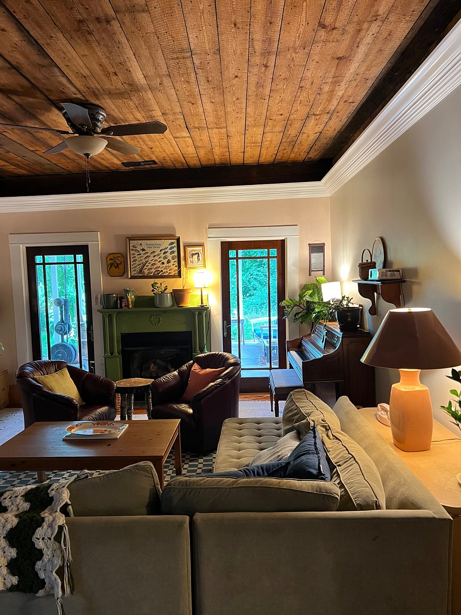 Our cozy living room! Includes a projector and a piano.