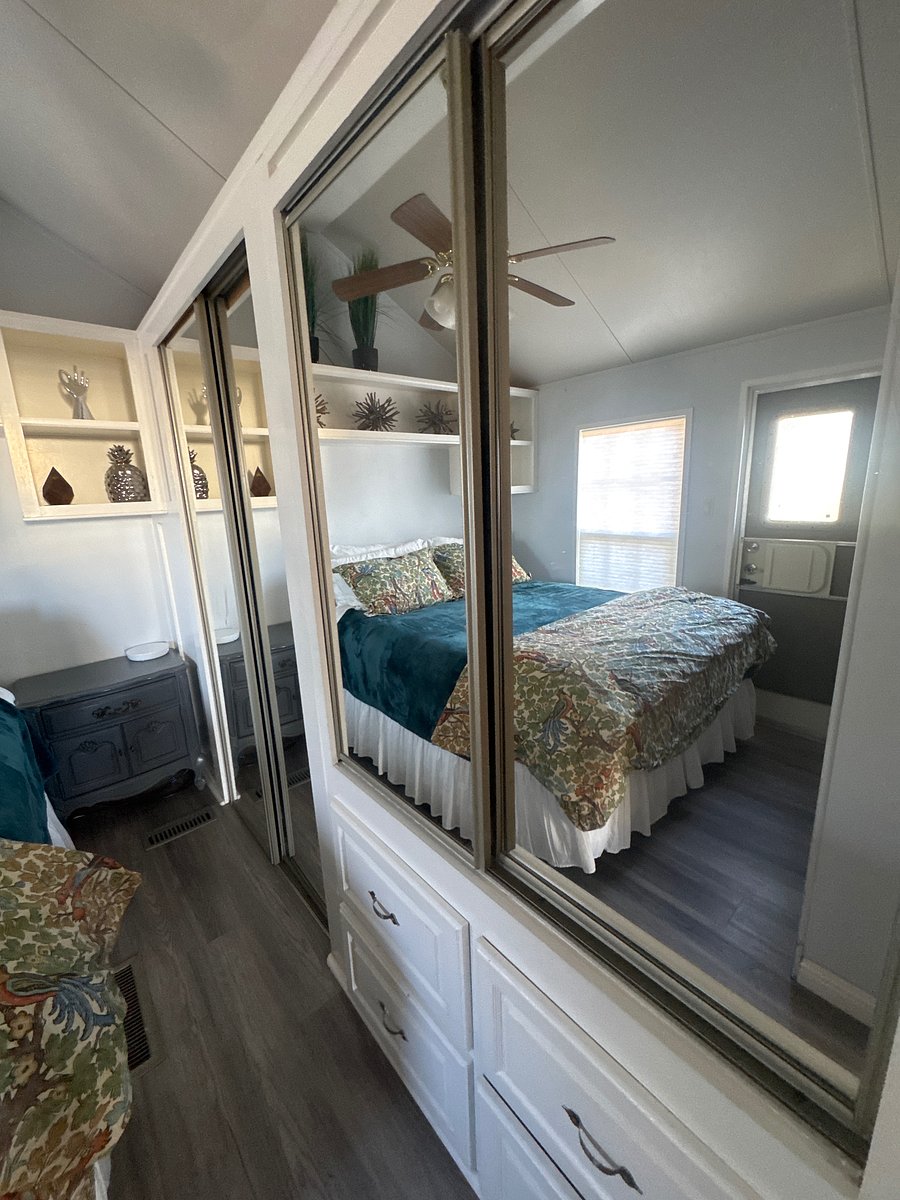 Master bedroom queen, size bed, closet, built-in drawers, a desk, TV, nightstand lamp