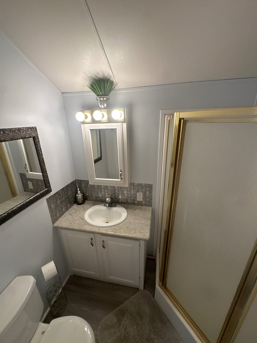 Bathroom with a cupboard shower