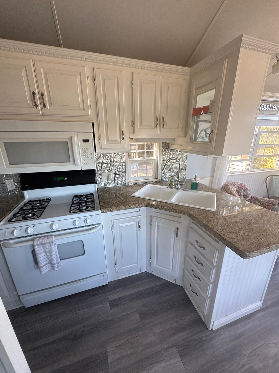 Full kitchen stove, microwave pots pans in the refrigerator plates, silverware cooking utensils