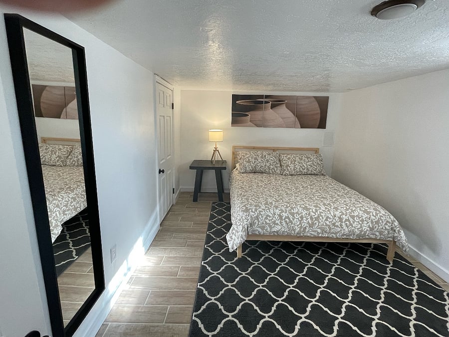 larger bedroom with queen sized bed