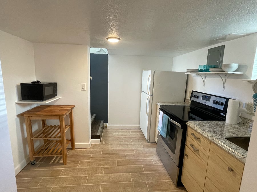 View of kitchen with stairs to outside