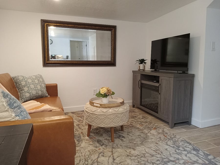 Another view of living room with fireplace heater