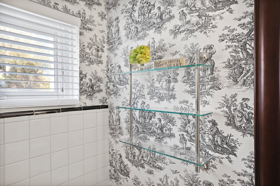 glass shelving beside the sink for your toiletries