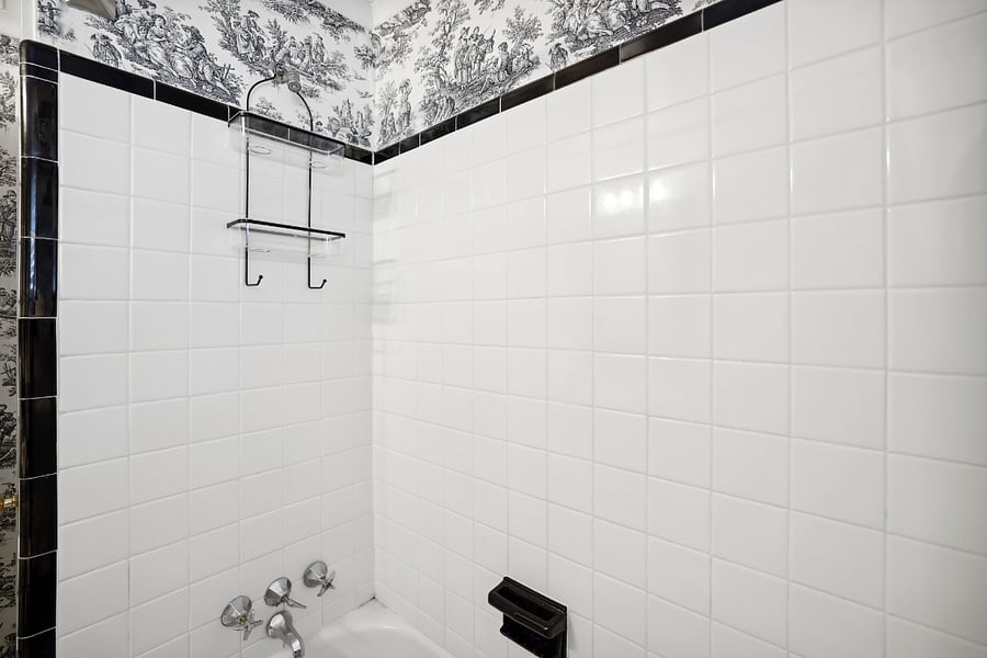 fully tiled bathroom with shower