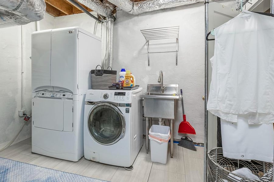 shared laundry room adjacent to guest's den