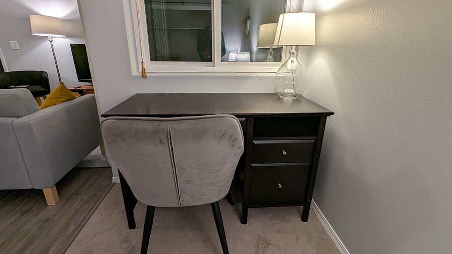 I have changed the desk to a motorized sit/stand desk. I will get a photo the next time I visit the unit.