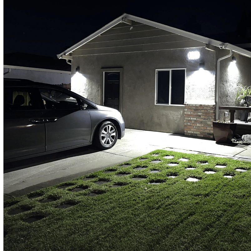 Nighttime outside view of property.