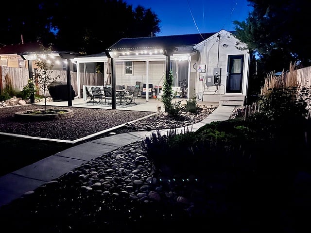Backyard patio and separate private keypad apartment entrance on the right (black door)