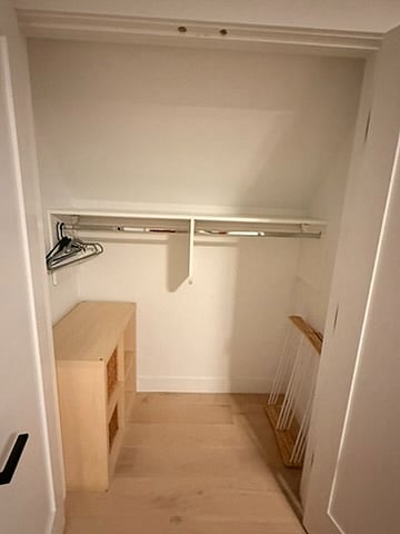 Interior of closet. Ikea shelves serve as storage, which can be moved to best serve tenant needs. 