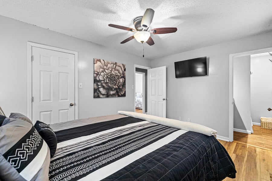 Primary bedroom with 42" smart TV.