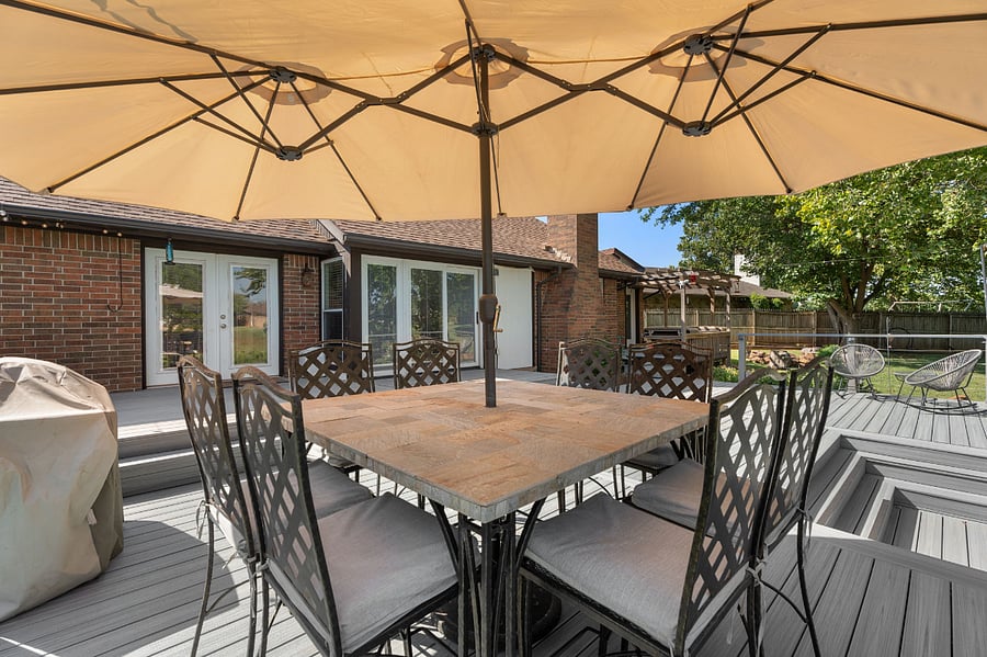 Propane grill and large table with umbrella for al fresco dining