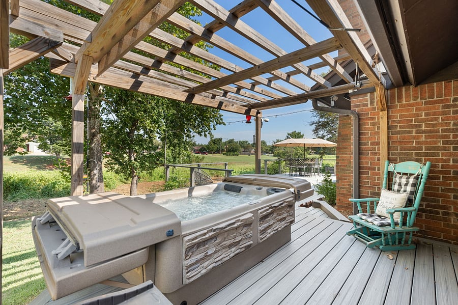 Hot tub located outside of primary suite