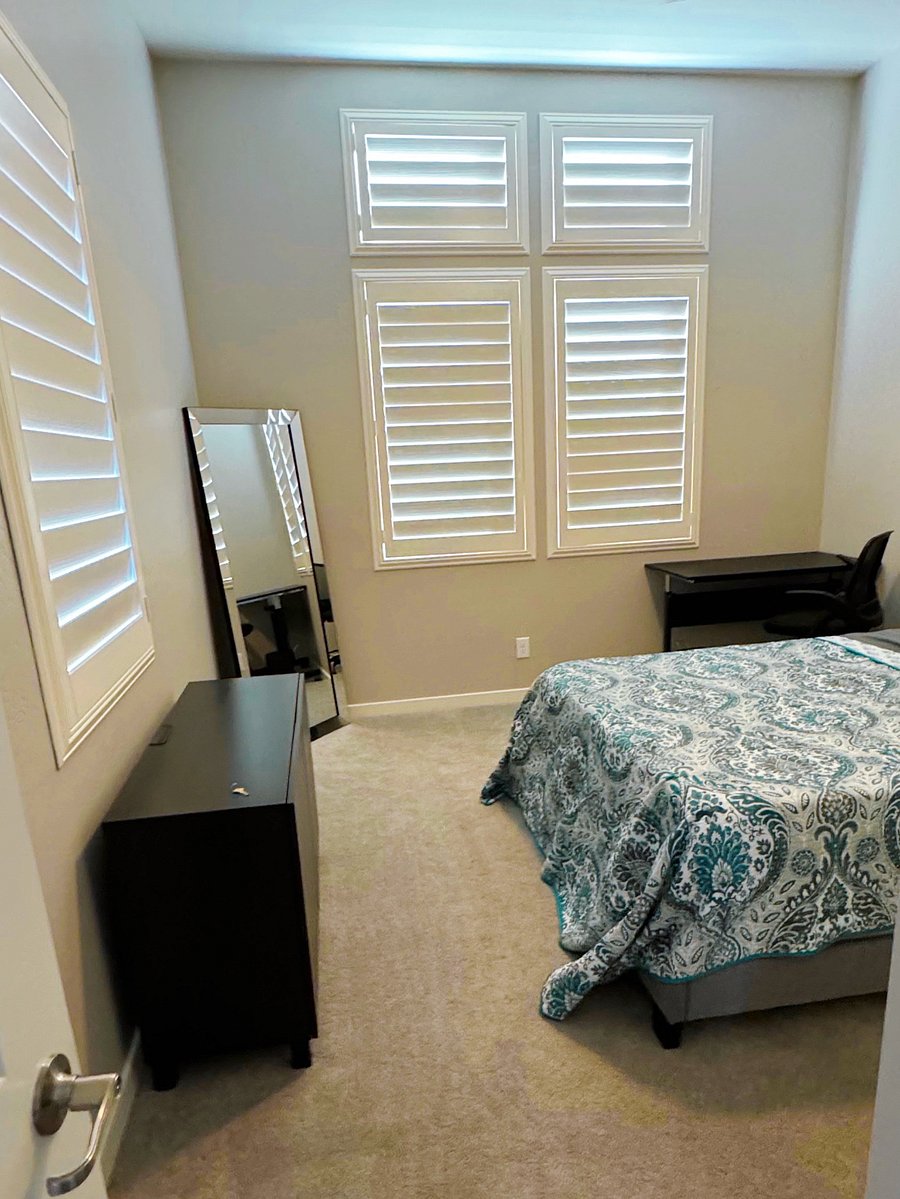 South bedroom with queen bed and shared bathroom.