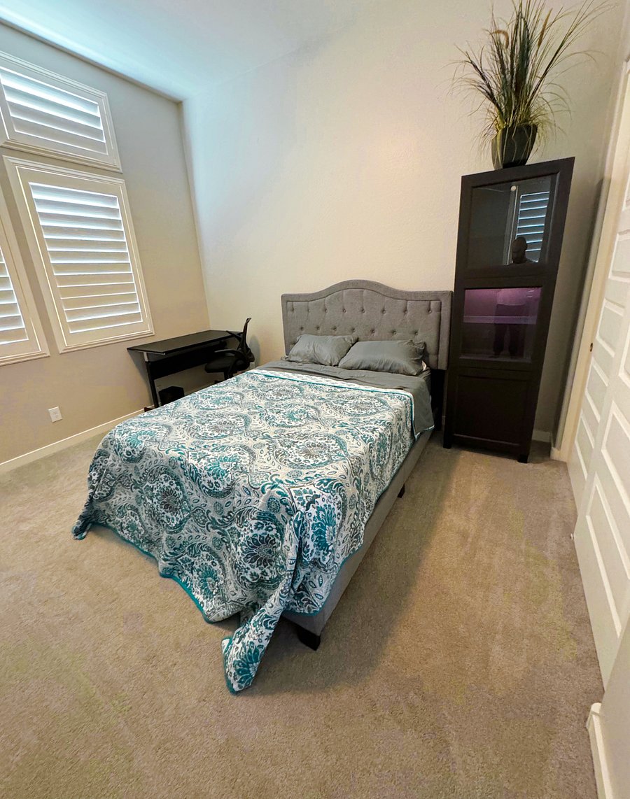 South bedroom with queen bed and shared bathroom.
