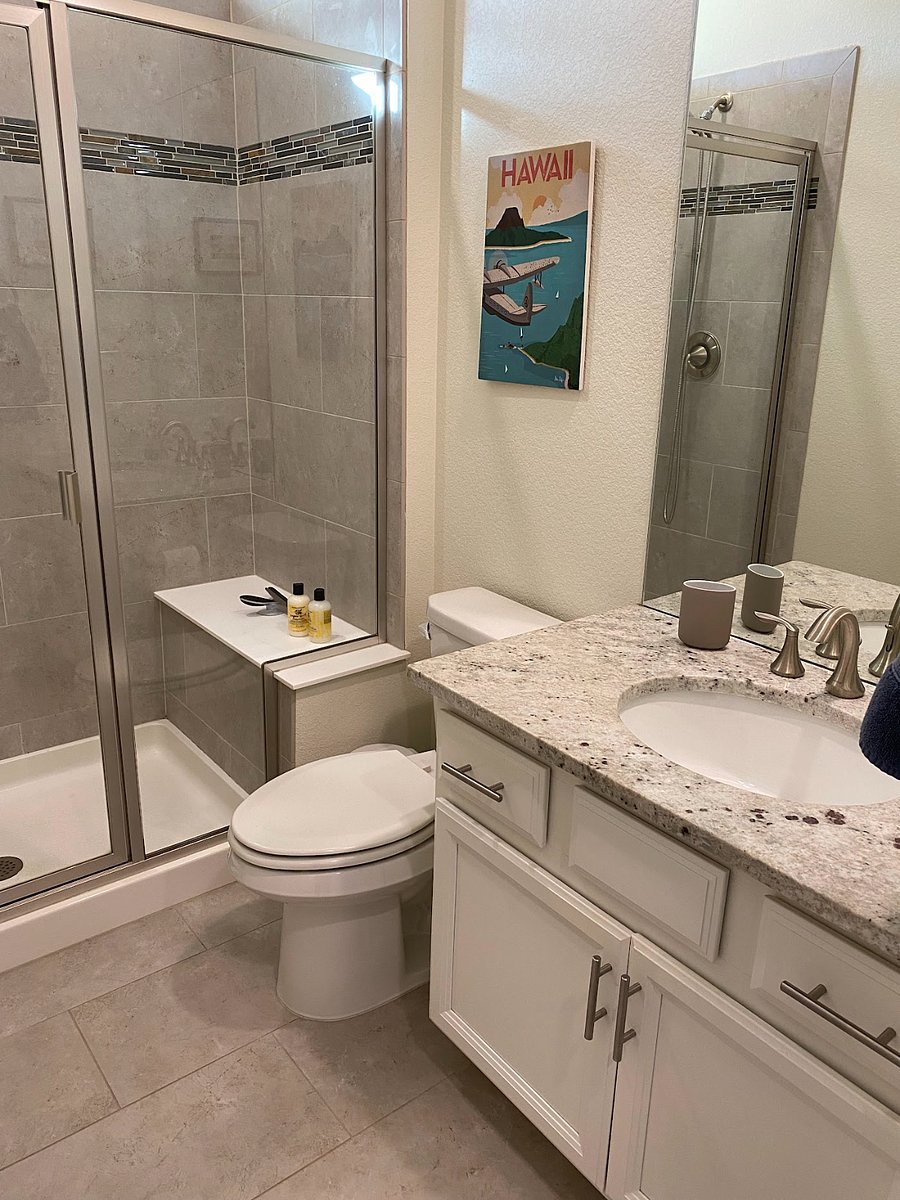 Private full bathroom with shower. 
 There is also a seat in the shower but no bathtub.