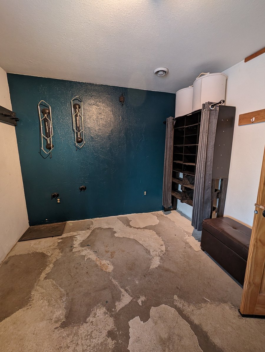 Laundry room has a lot of storage for bikes, skis, and whatever else you might need