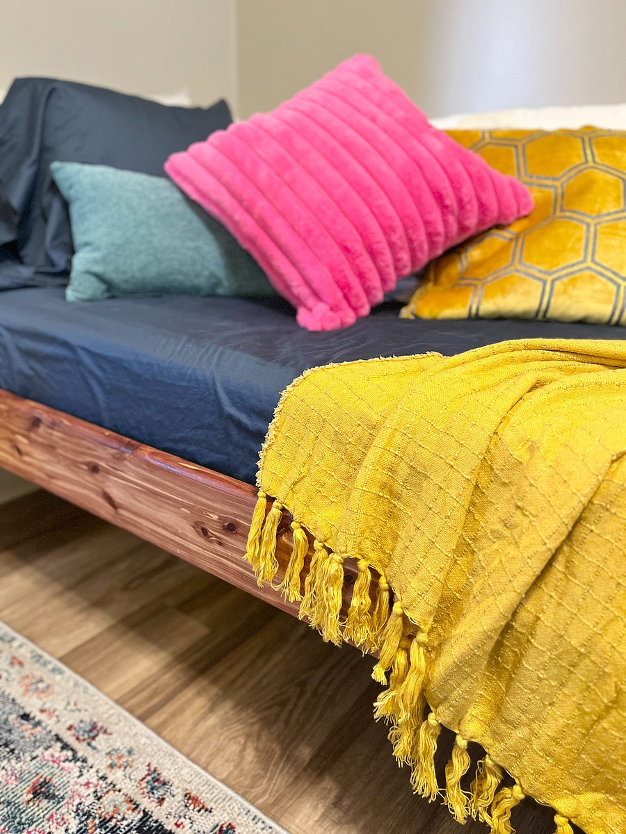 Soft pillows and throw blanket for cozy napping.