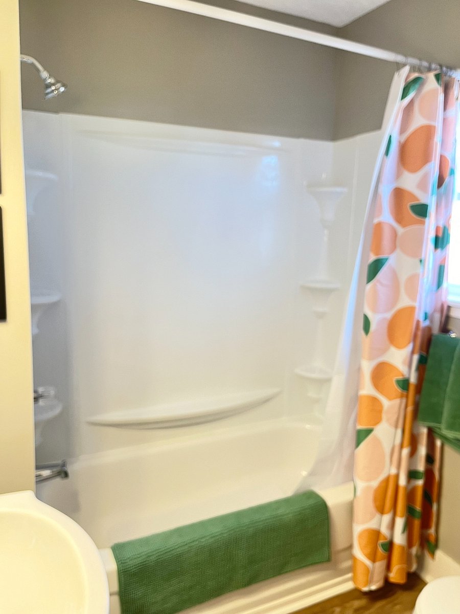 Tub/shower combo with NEW shower head for a hot shower at the end of a day's work.