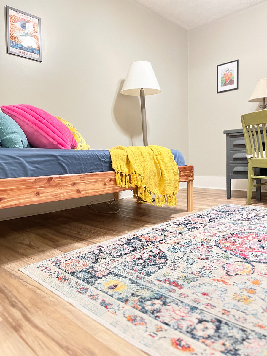 Rear bedroom/office with twin daybed, full desk, and large walk-in closet.